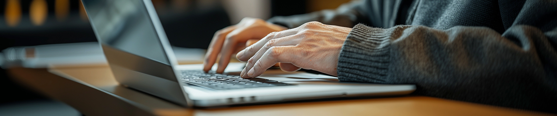 Technical support specialist using laptop for floor scrubber documentation